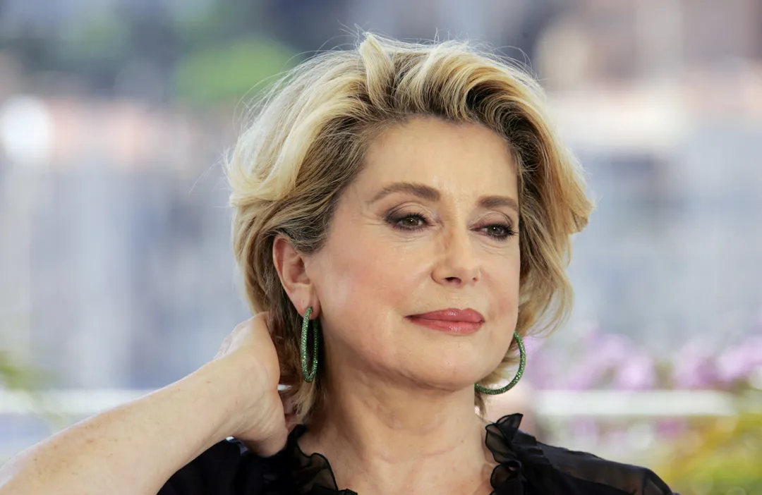 French actress Catherine Deneuve gestures during a photo call for the "Lecon d'Actrice" (the Acting Masterclass) at the 58th edition of the International Cannes Film Festival 12 May 2005. Since 1991, the Film Masterclass has a world renowned filmmaker or actor giving a public lesson. The Cannes film festival, the world's top showcase of cinema, started 11 May with a slew of veteran auteurs lining up for the prestigious Palme d'Or prize, and Hollywood muscling in to promote this year's blockbusters.                AFP PHOTO   FRANCOIS GUILLOT